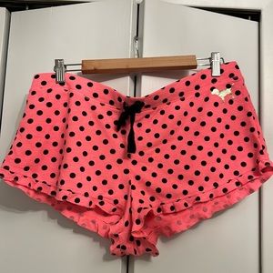 Pink ruffled sleep shorts in hot pink with black polka dots. Size Large